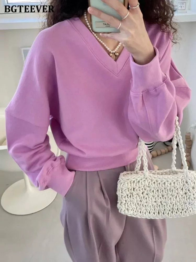 Felpa donna rosa con scollo a V e maniche lunghe vista frontale