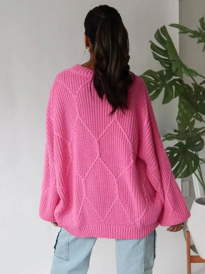 Maglione donna fucsia oversize a maglia visto da dietro con maniche ampie
